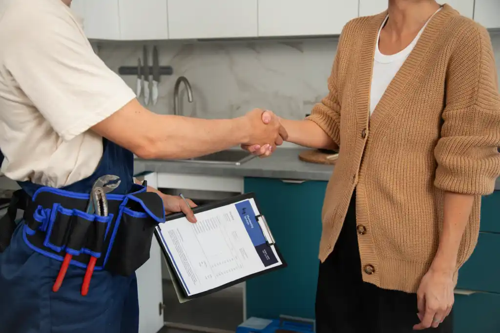 technician shaking hand with customer after gas safety check