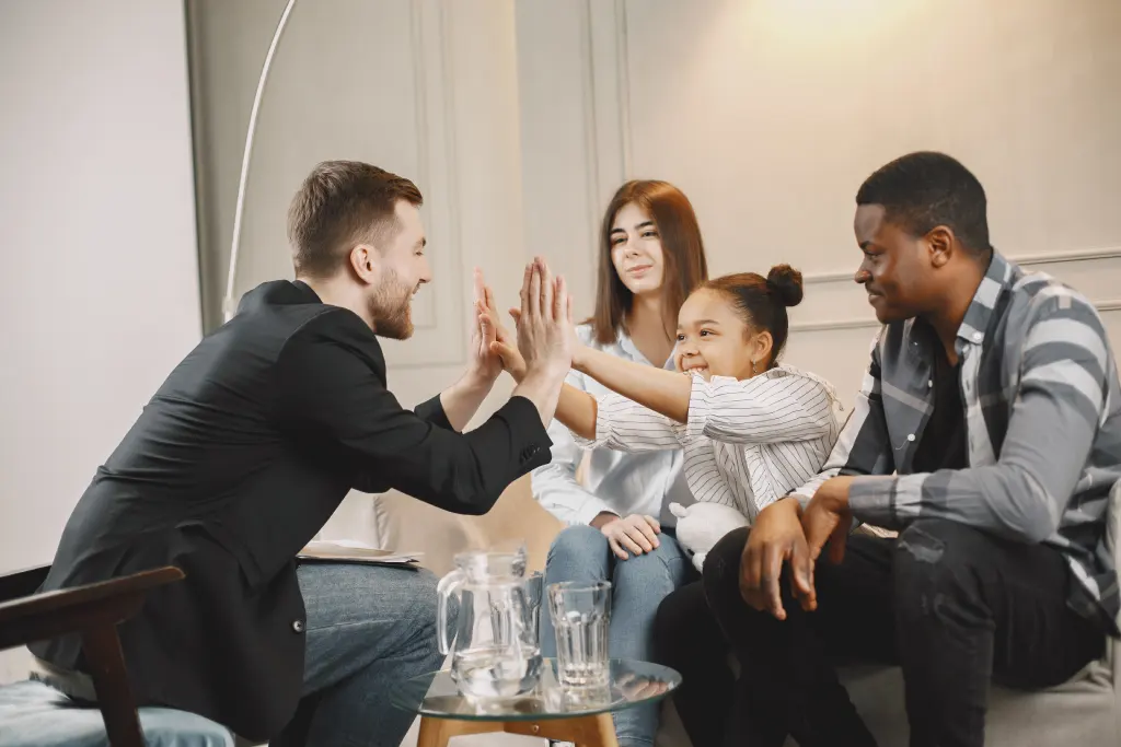 a family high five representing working together to safeguard children